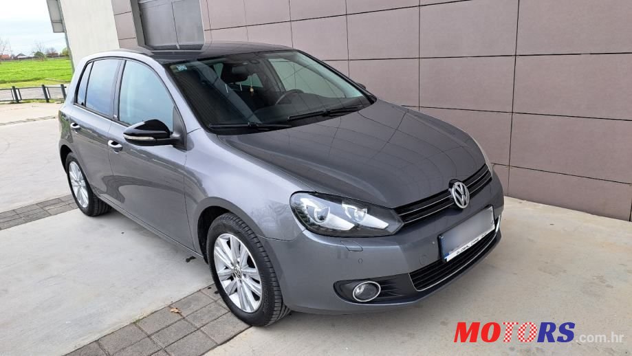 2011' Volkswagen Golf VI 1,6 Tdi photo #1