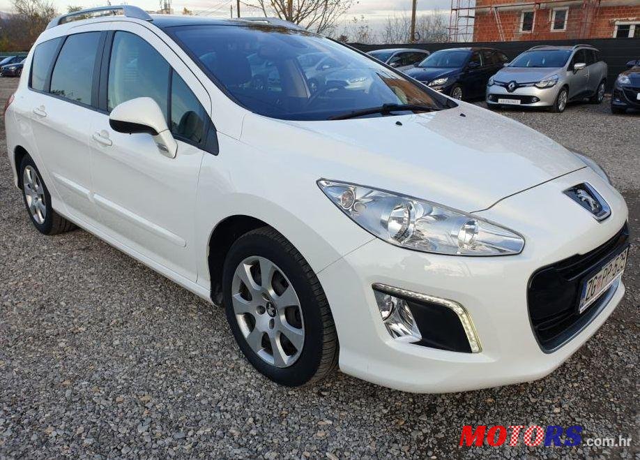 2013' Peugeot 308 Sw 1,6 E-Hdi photo #1