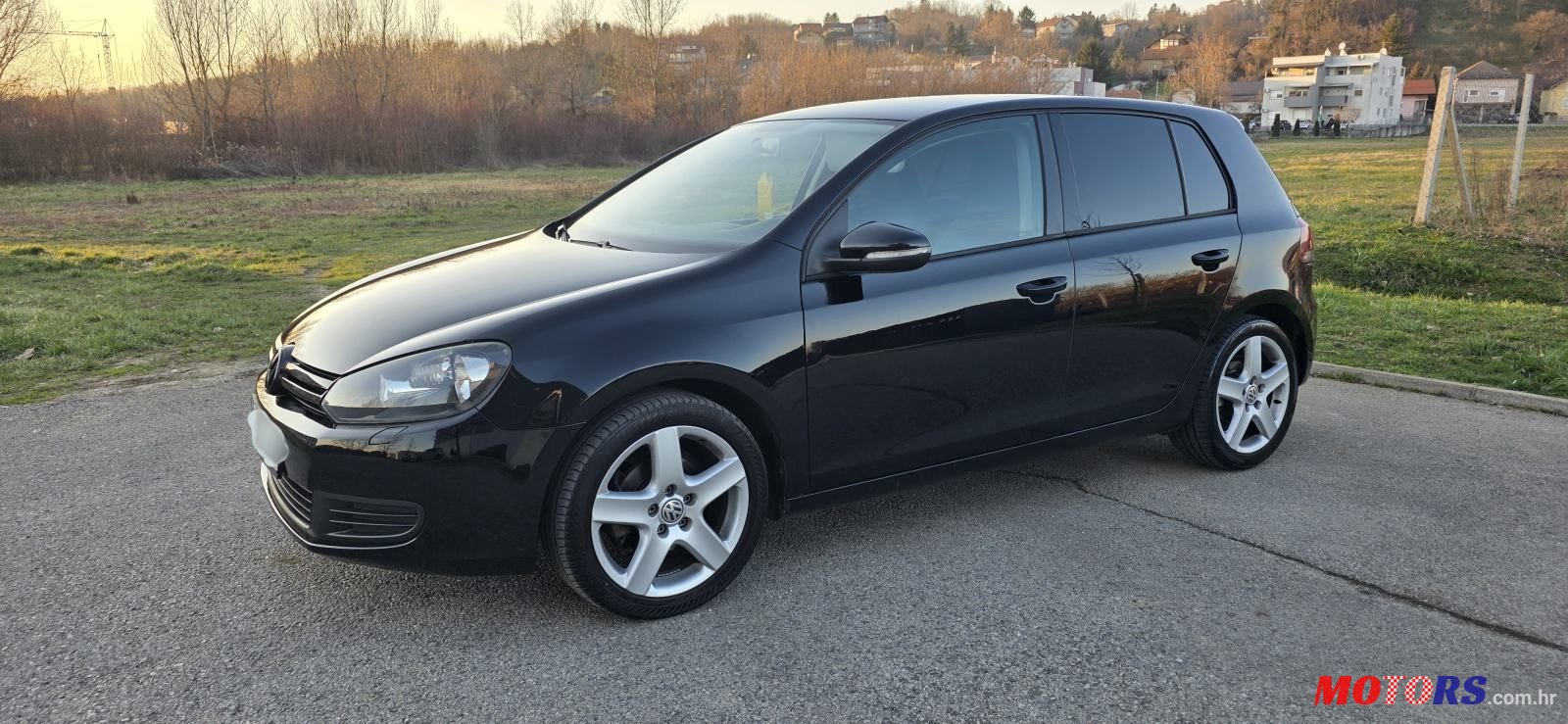 2009' Volkswagen Golf VI 1,6 photo #1