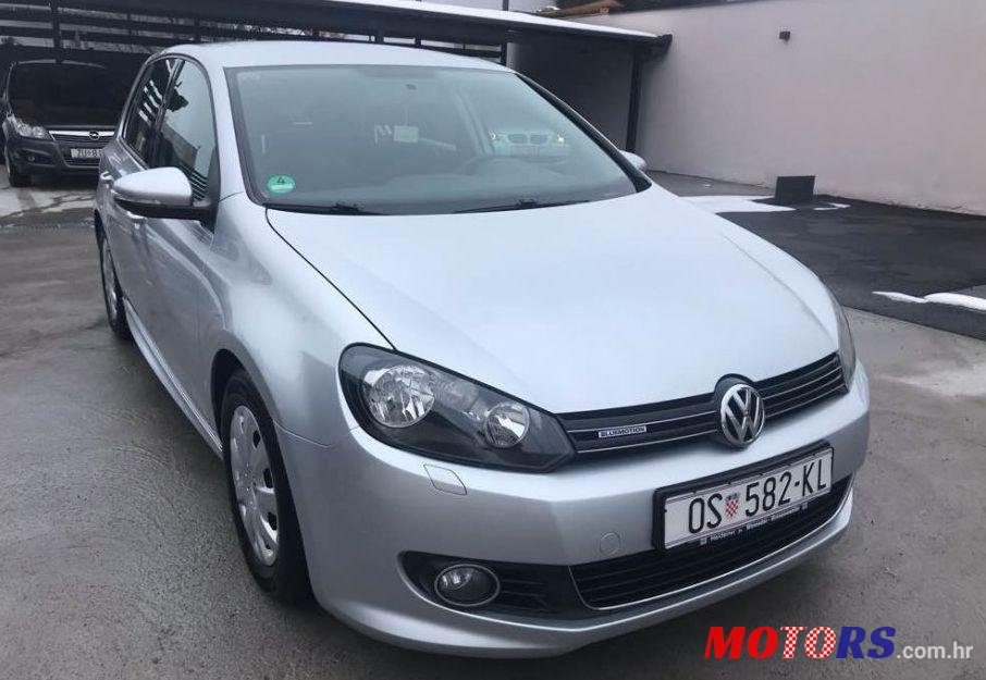 2011' Volkswagen Golf VI 1,6 Tdi photo #1