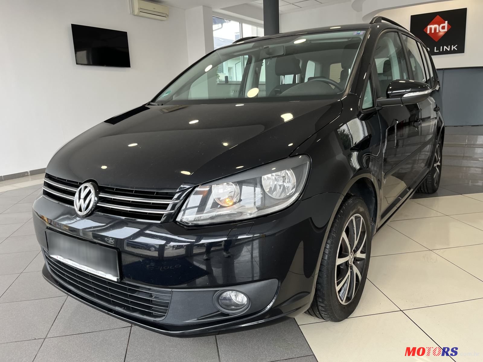 2013' Volkswagen Touran 1,6 Tdi photo #1