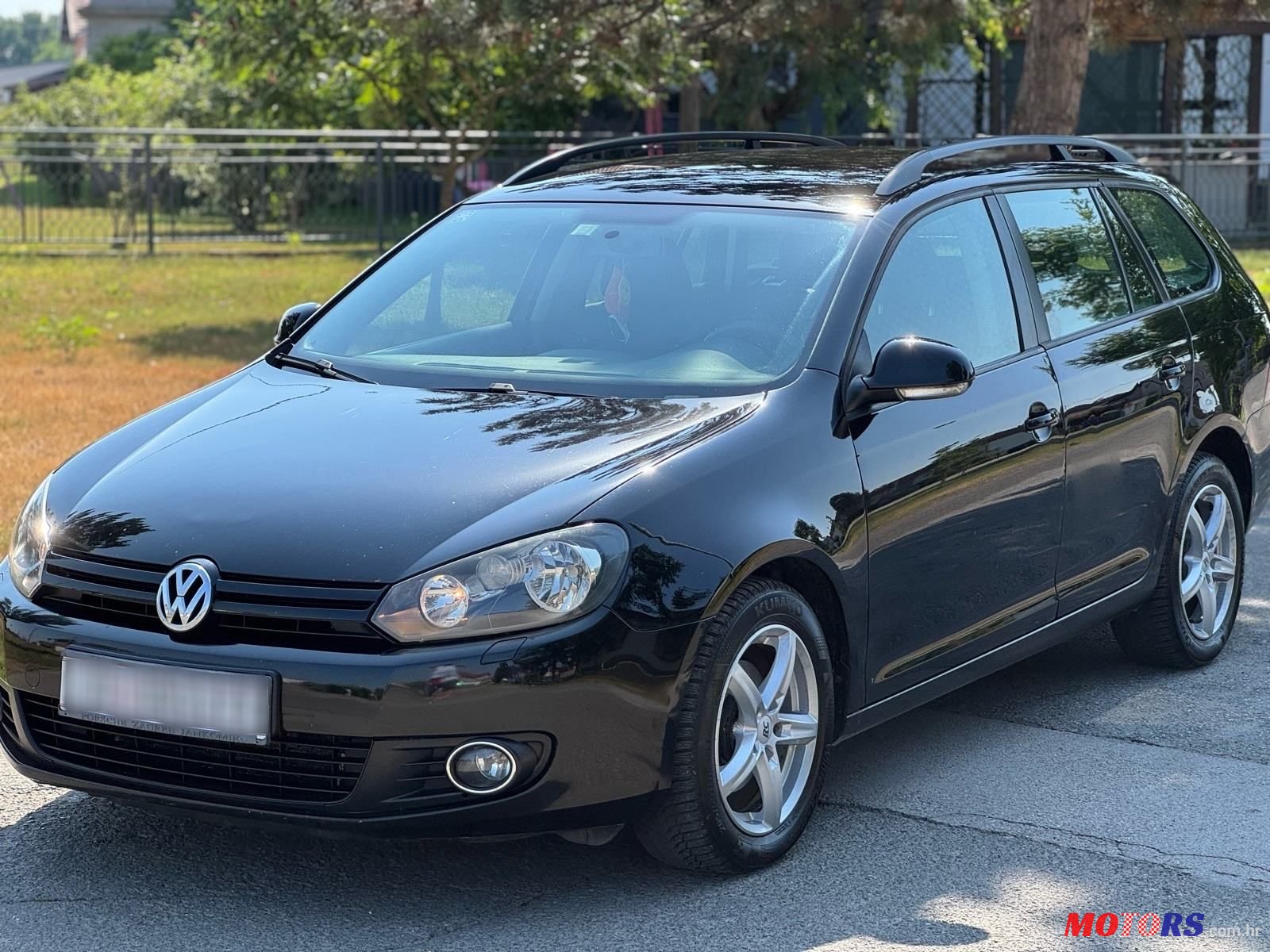 2011' Volkswagen Golf VI Variant photo #1