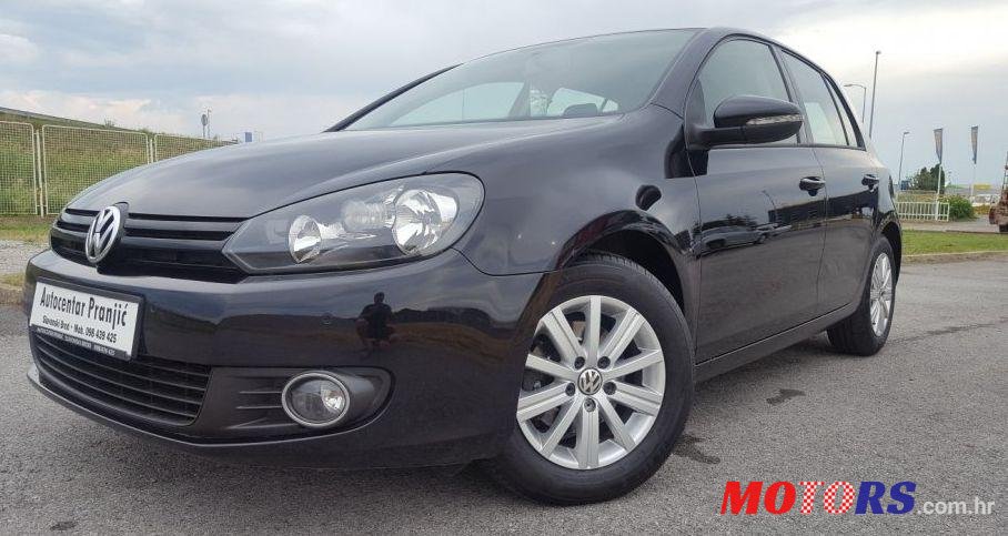 2012' Volkswagen Golf VI 1,6 Tdi photo #1