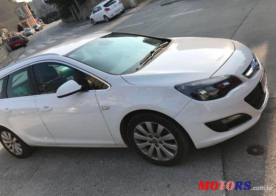 2014' Opel Astra Karavan photo #1