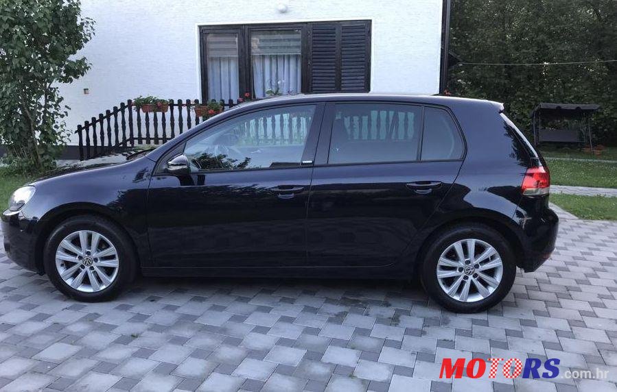 2011' Volkswagen Golf VI 1,6 Tdi photo #1