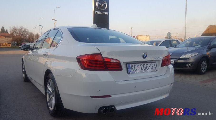 2012' BMW 5 Series 520D photo #1