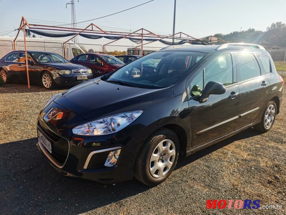 2012' Peugeot 308 Sw photo #1