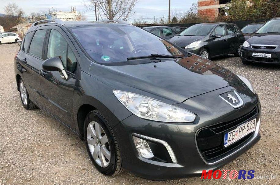 2012' Peugeot 308 Sw photo #1