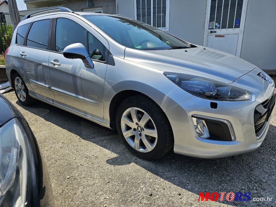 2014' Peugeot 308 Sw photo #1