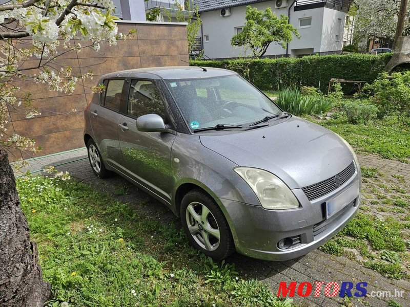 2009' Suzuki Swift 1,3 Gc photo #1