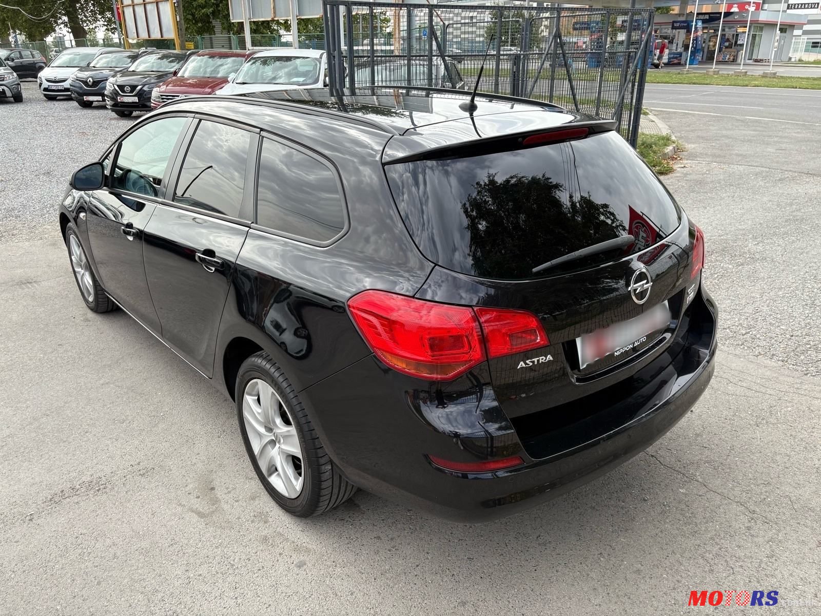 2011' Opel Astra Karavan photo #4