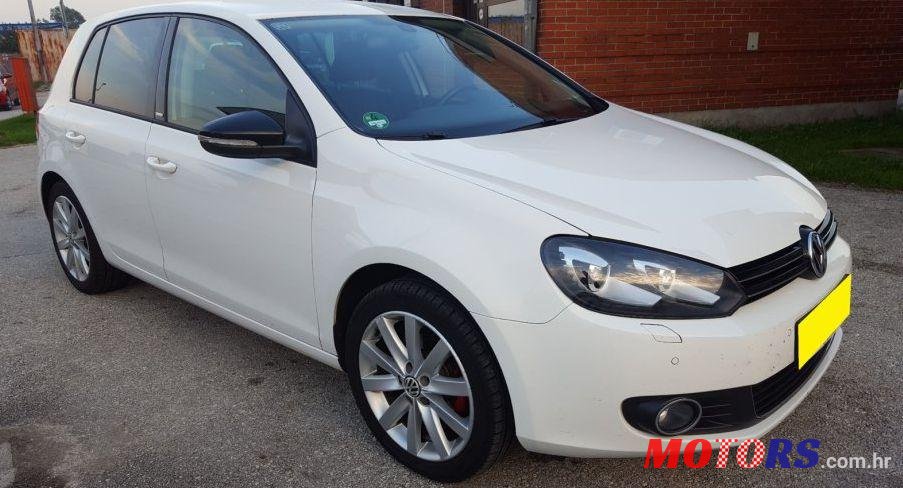 2011' Volkswagen Golf VI 1,6 Tdi photo #1
