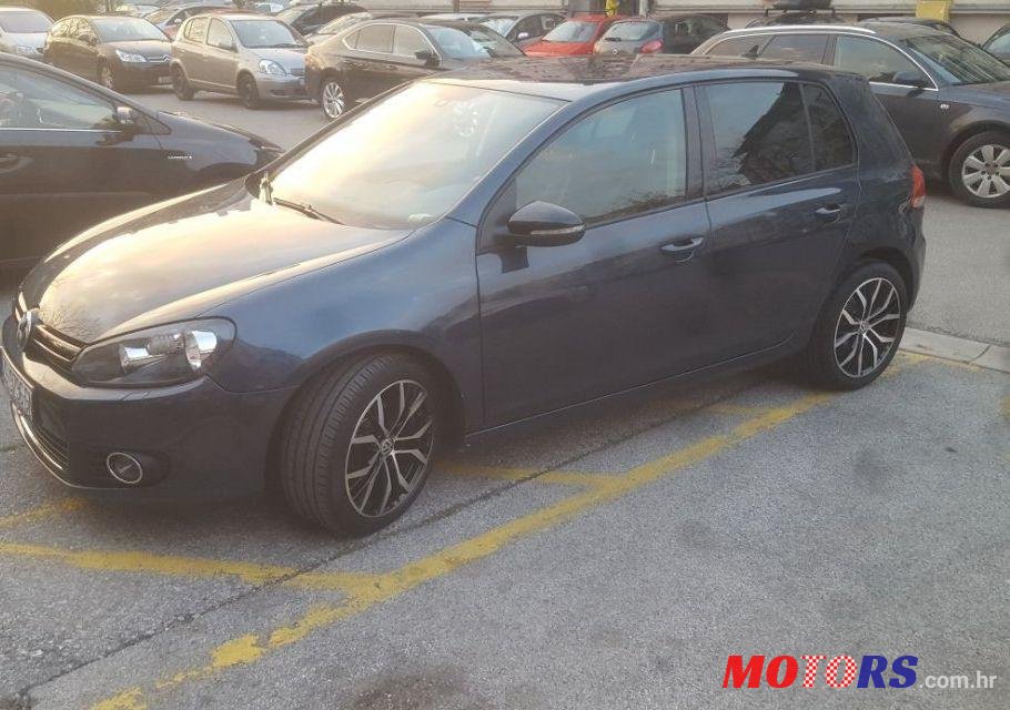 2012' Volkswagen Golf VI 1,6 Tdi photo #1