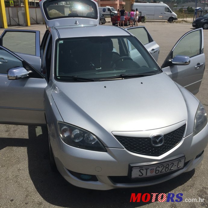 2004' Mazda 3 photo #1