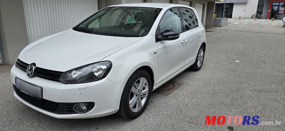 2012' Volkswagen Golf VI 1,6 Tdi photo #1