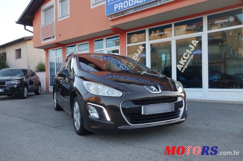 2012' Peugeot 308 Sw photo #1