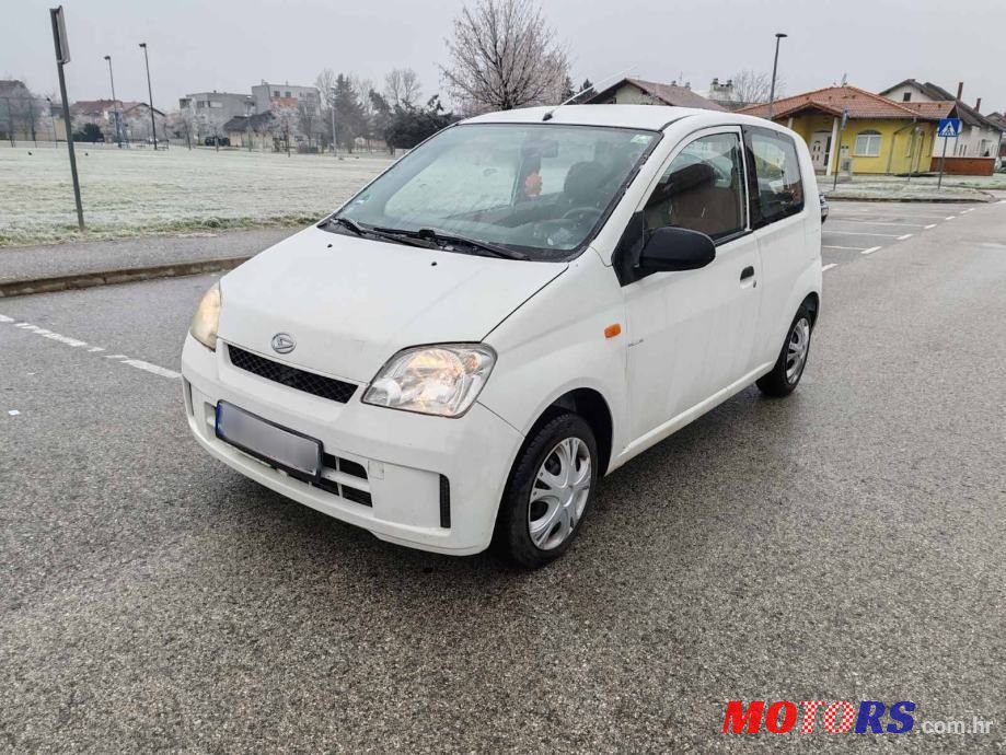2004' Daihatsu Cuore Pur photo #1