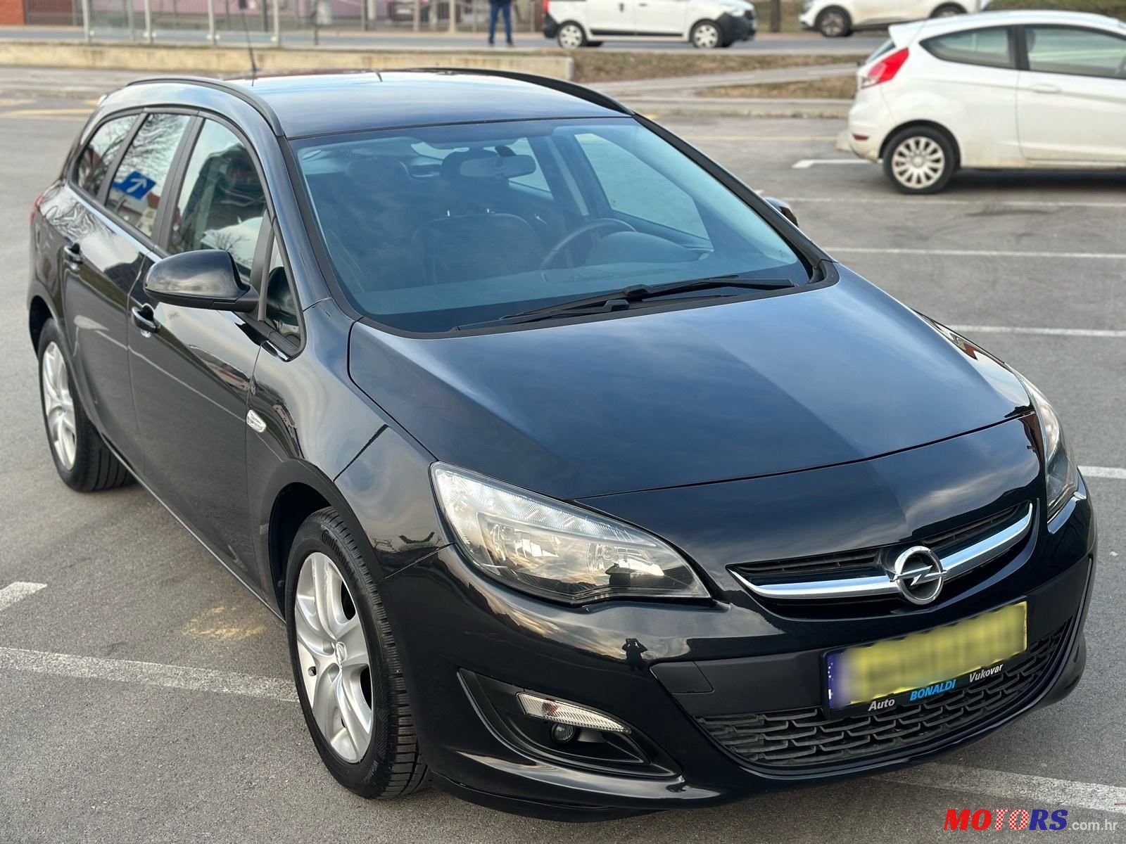 2015' Opel Astra Karavan photo #2