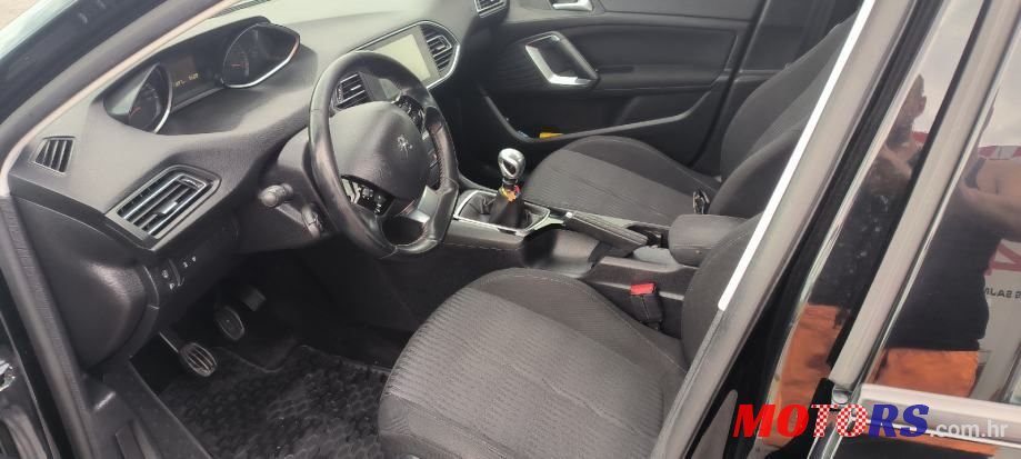 2014' Peugeot 308 Sw photo #1