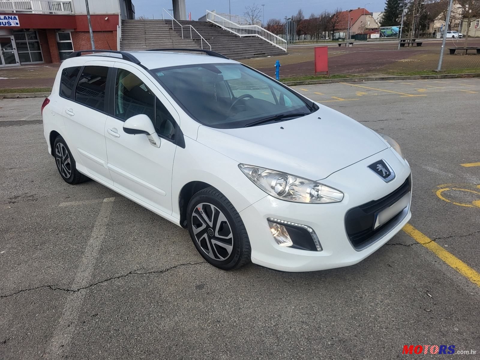 2013' Peugeot 308 Sw photo #1