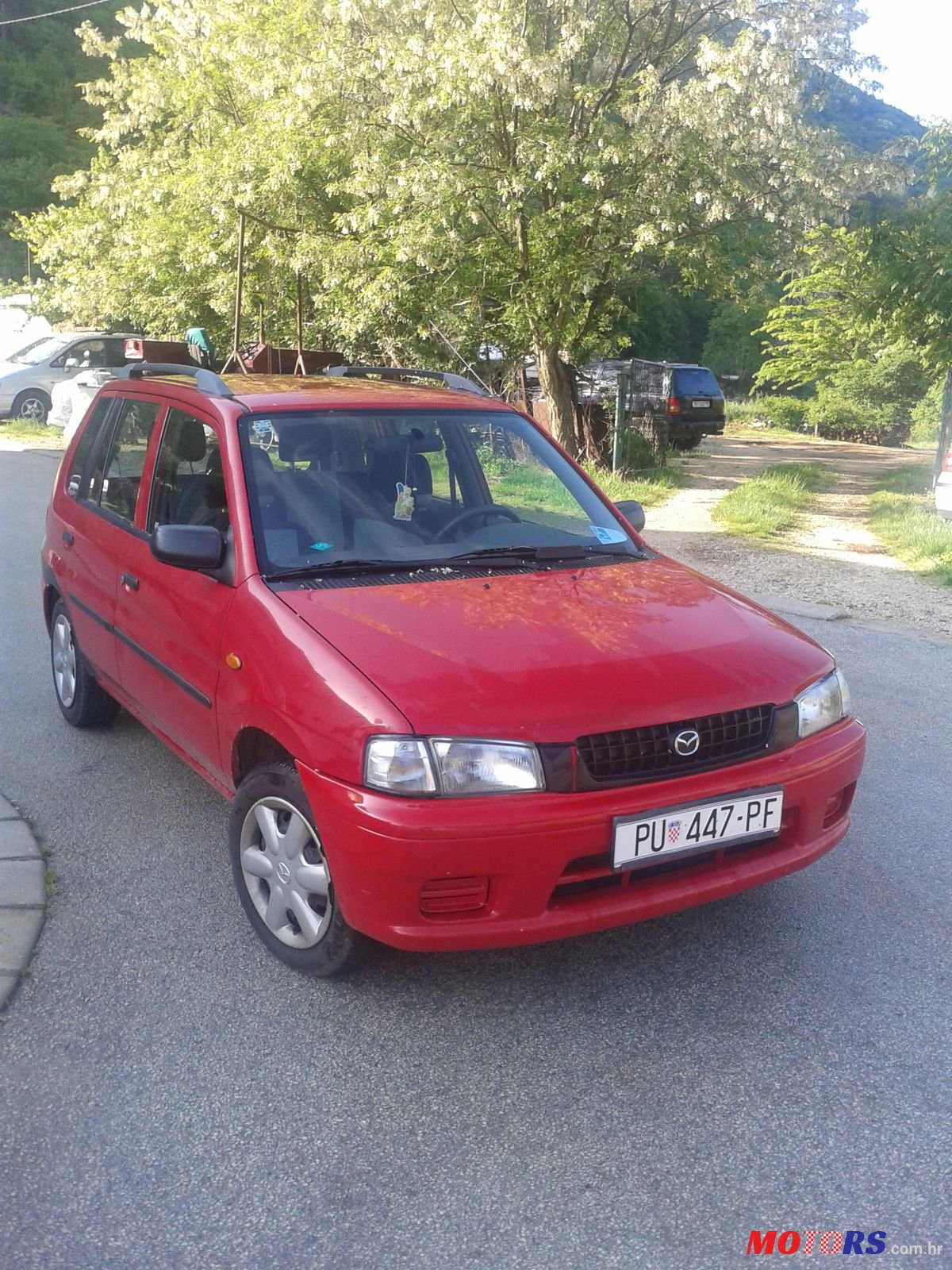 1999' Mazda Demio photo #1