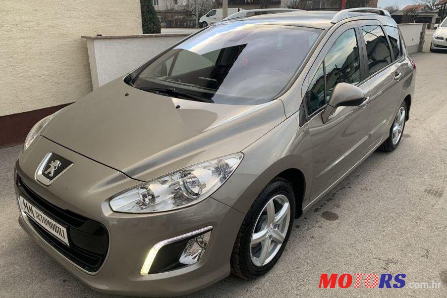 2012' Peugeot 308 Sw photo #1