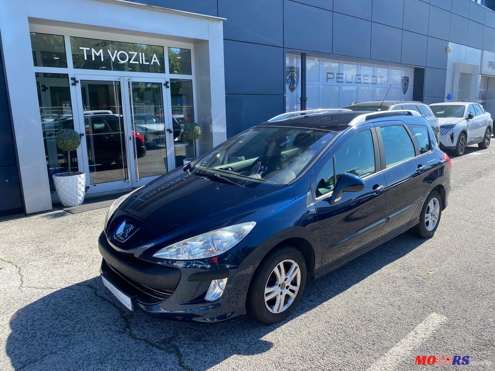 2009' Peugeot 308 Sw photo #1