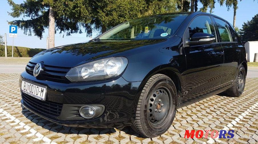 2012' Volkswagen Golf VI 1,6 Tdi photo #1