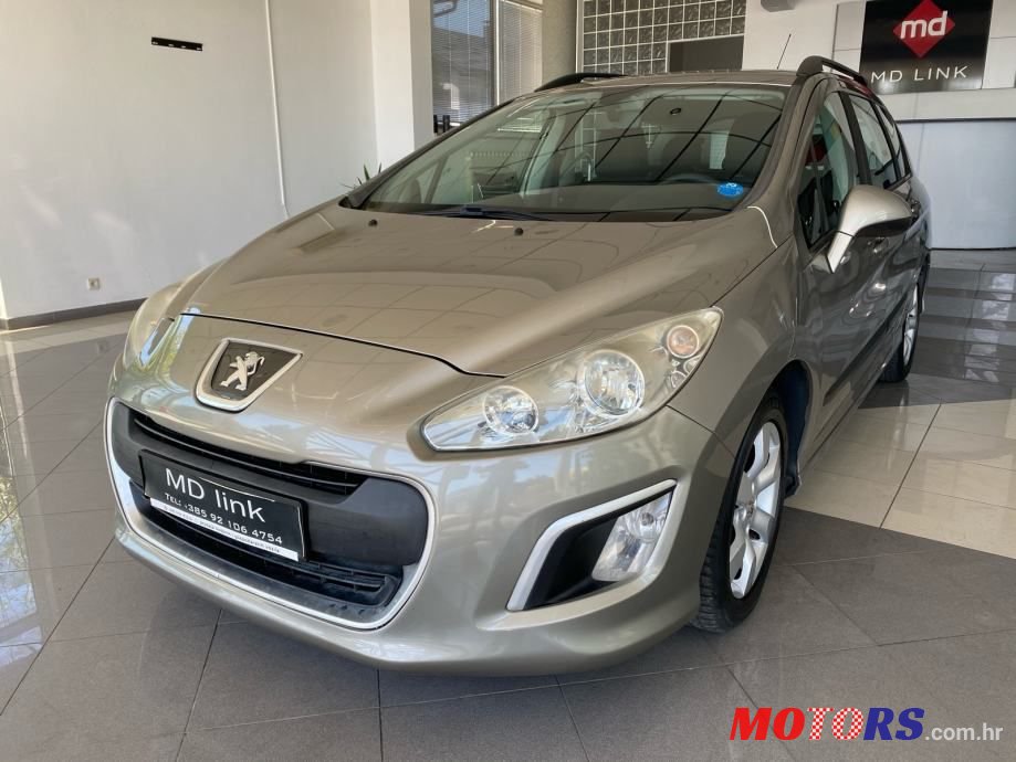 2012' Peugeot 308 Sw photo #1