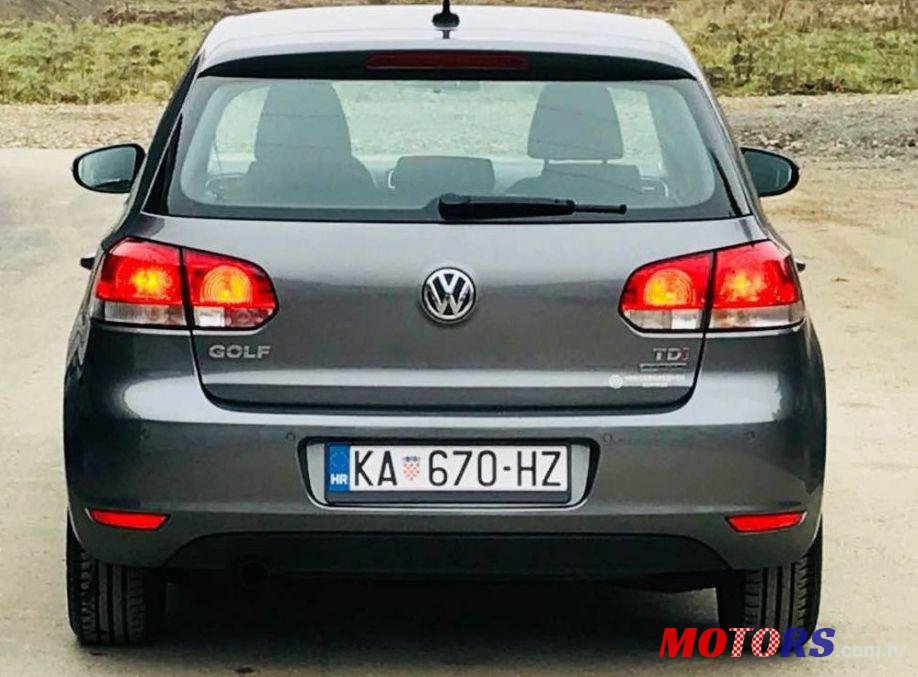 2012' Volkswagen Golf VI 1,6 Tdi photo #1