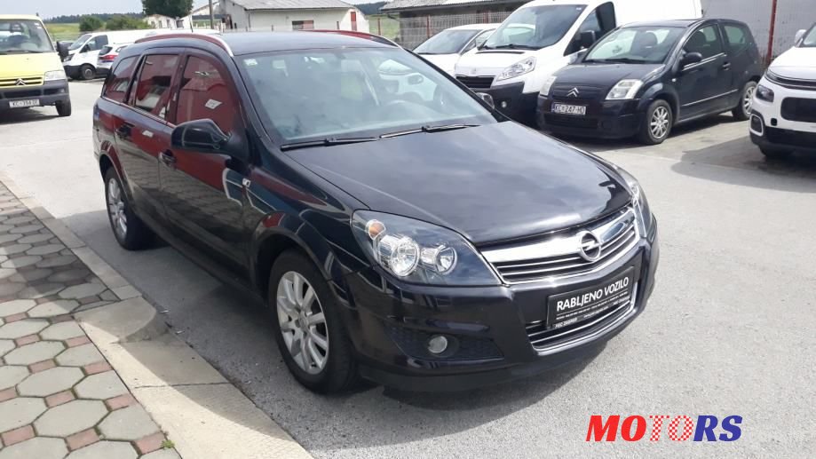 2012' Opel Astra Karavan photo #1