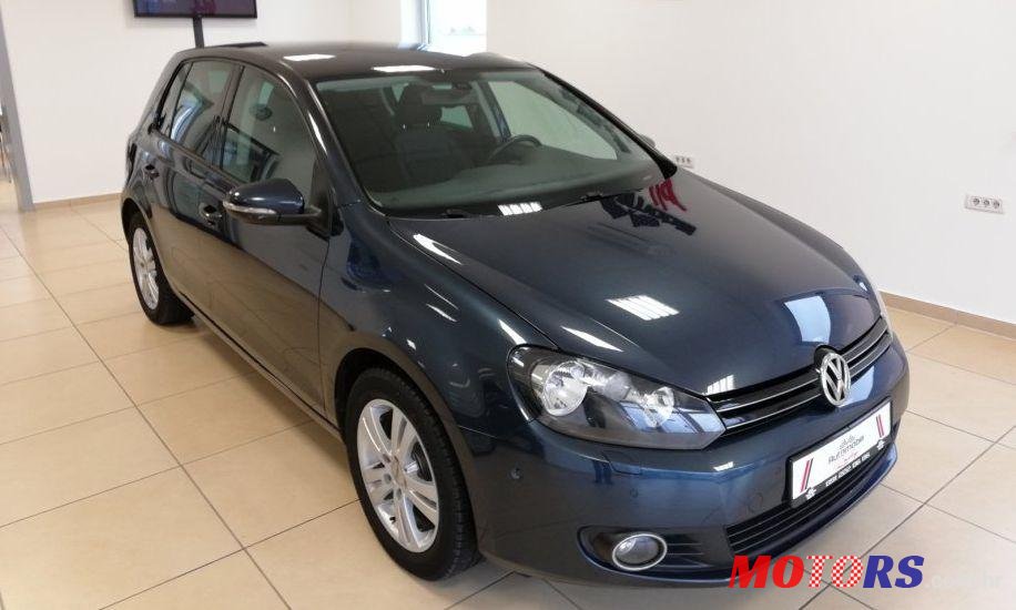 2011' Volkswagen Golf VI 1,6 Tdi photo #1