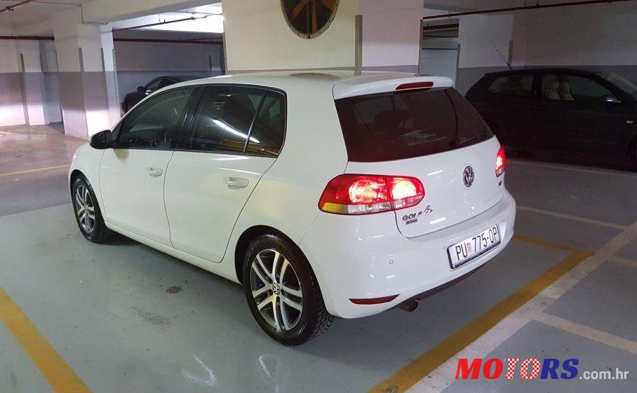 2012' Volkswagen Golf VI 1,6 Tdi photo #2