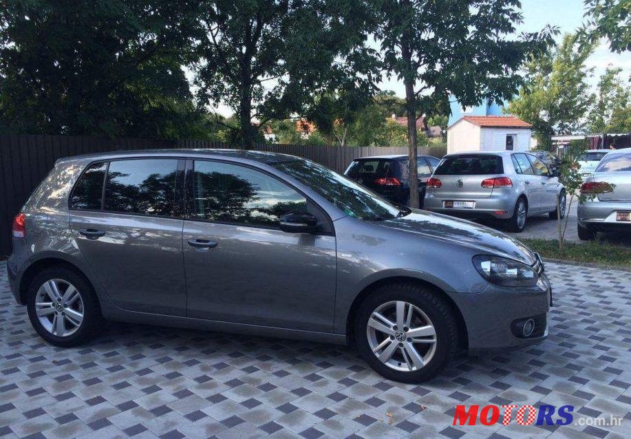 2012' Volkswagen Golf VI 1,6 Tdi photo #1