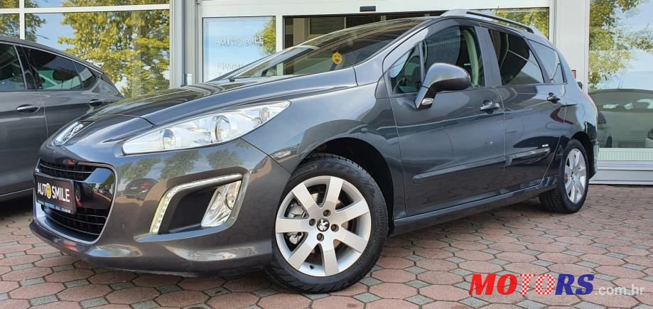 2012' Peugeot 308 Sw photo #1