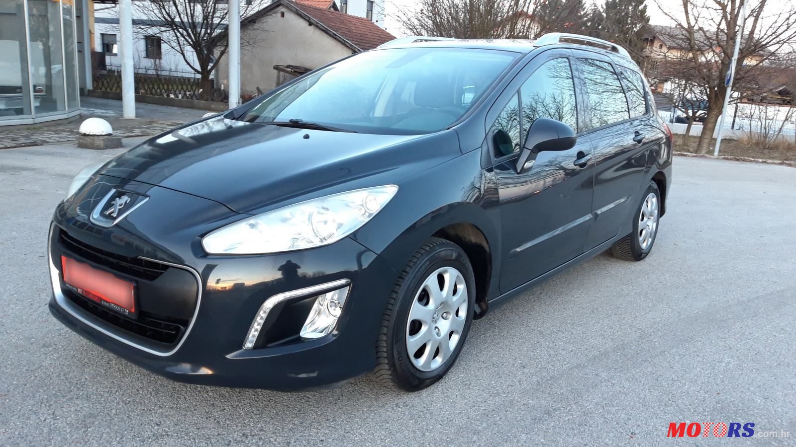 2013' Peugeot 308 Sw photo #1