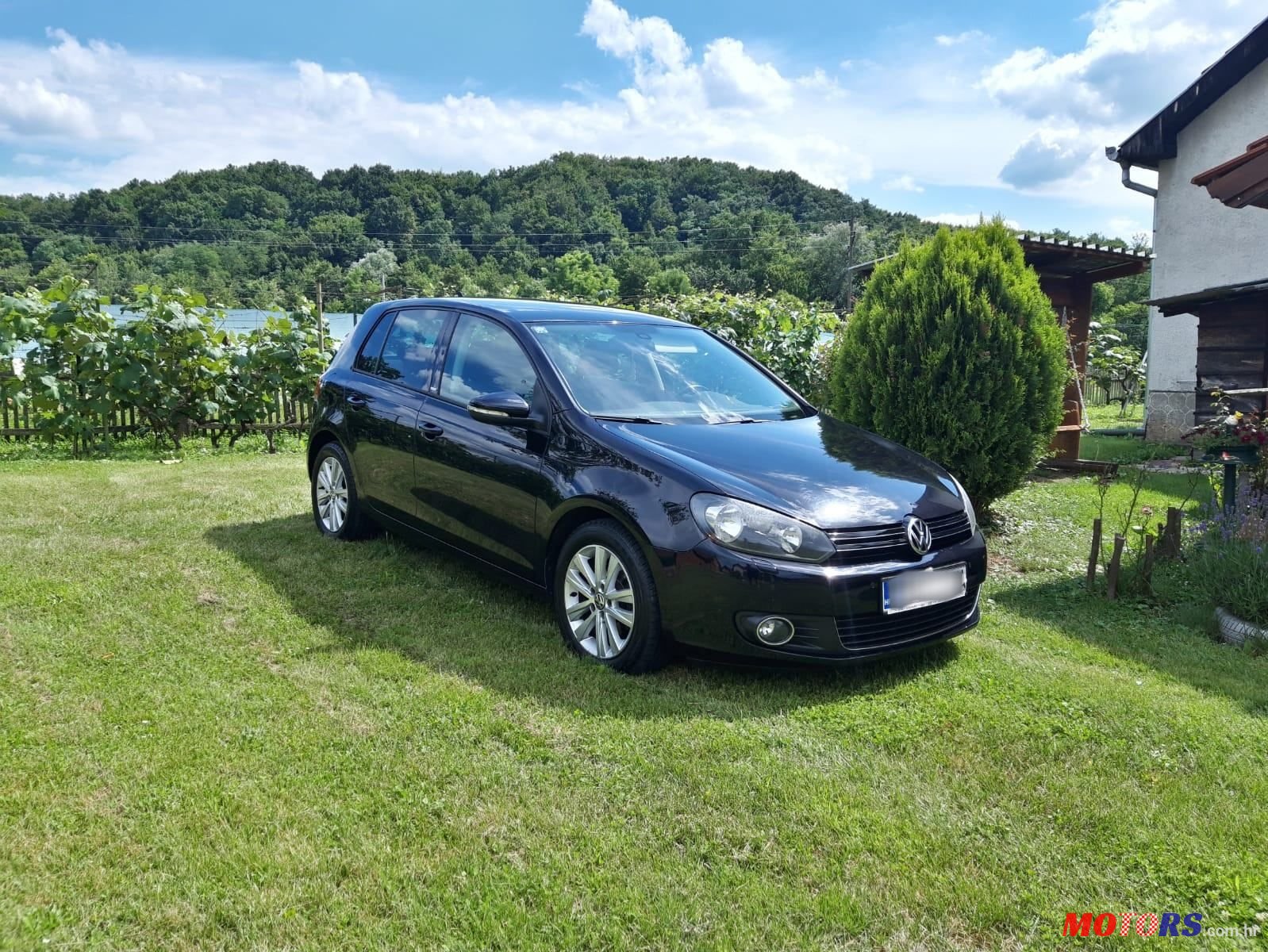 2011' Volkswagen Golf VI 1,6 Tdi photo #1
