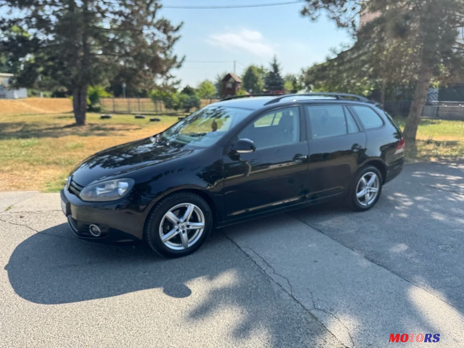 2011' Volkswagen Golf VI Variant photo #2