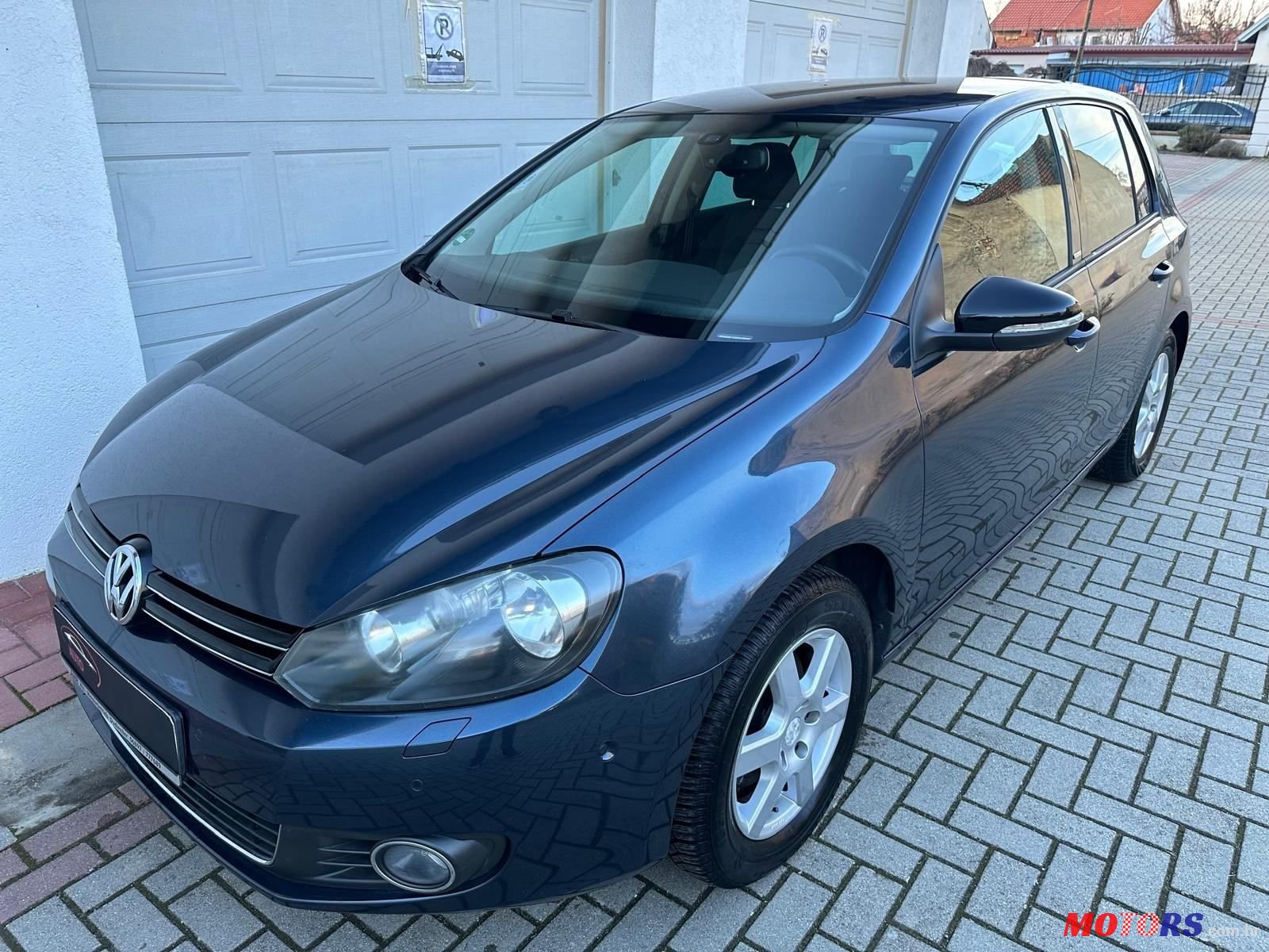 2012' Volkswagen Golf VI 1,6 Tdi photo #1