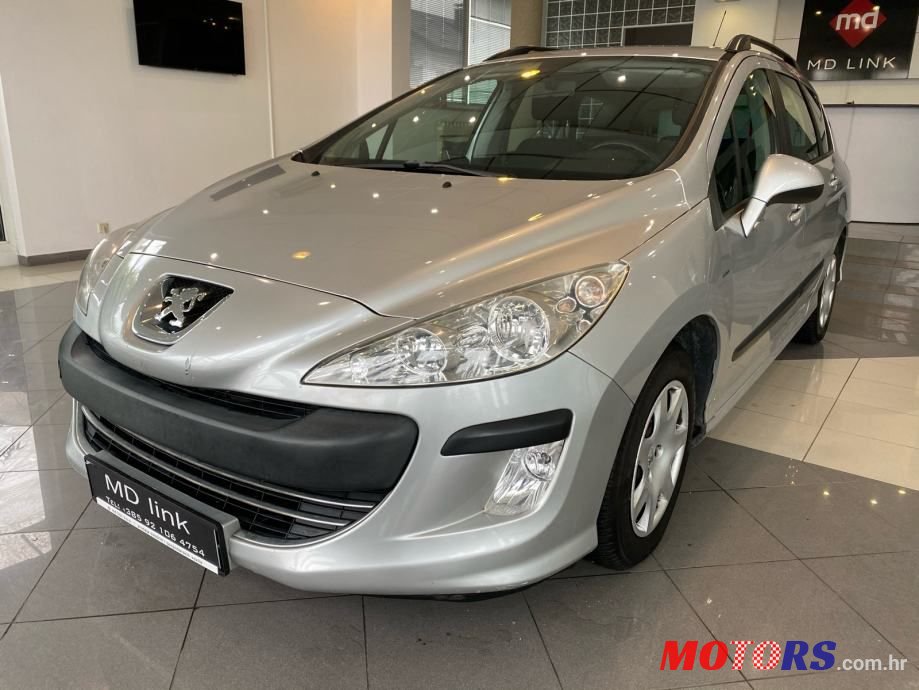2009' Peugeot 308 Sw photo #1
