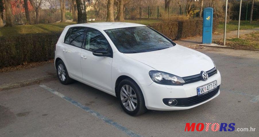 2012' Volkswagen Golf VI 1,6 Tdi photo #1