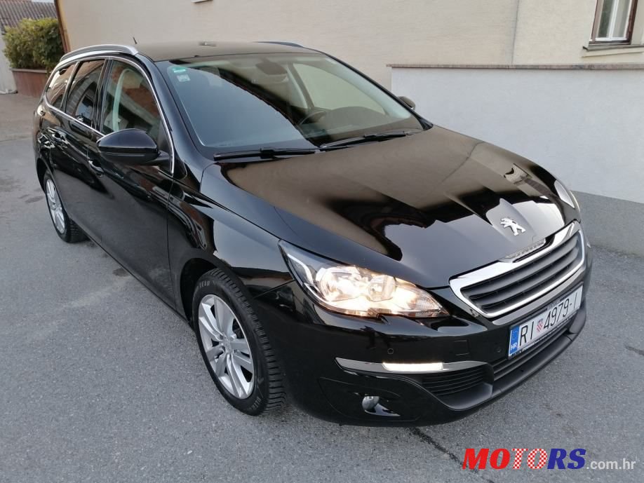 2014' Peugeot 308 Sw photo #1