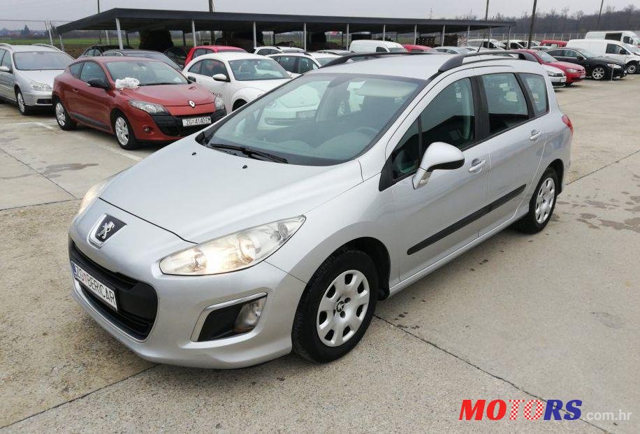 2011' Peugeot 308 Sw 1,6 E-Hdi photo #1