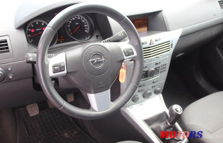 2011' Opel Astra Karavan photo #1