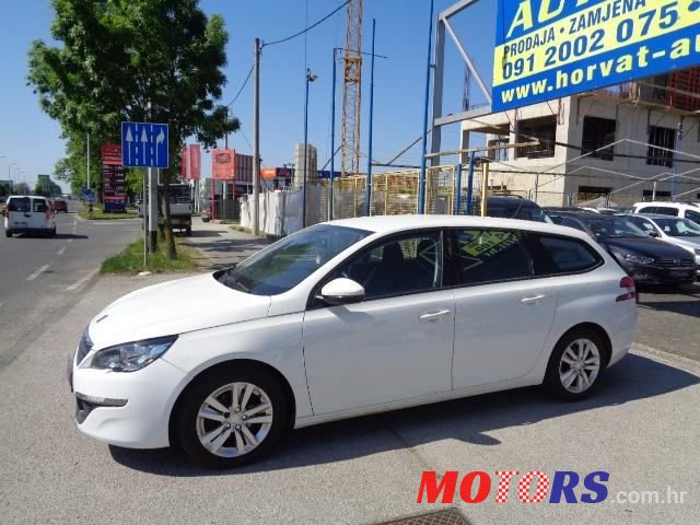 2014' Peugeot 308 Sw photo #1