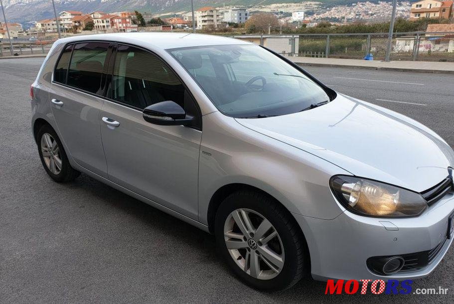 2012' Volkswagen Golf VI 1,6 Tdi photo #1
