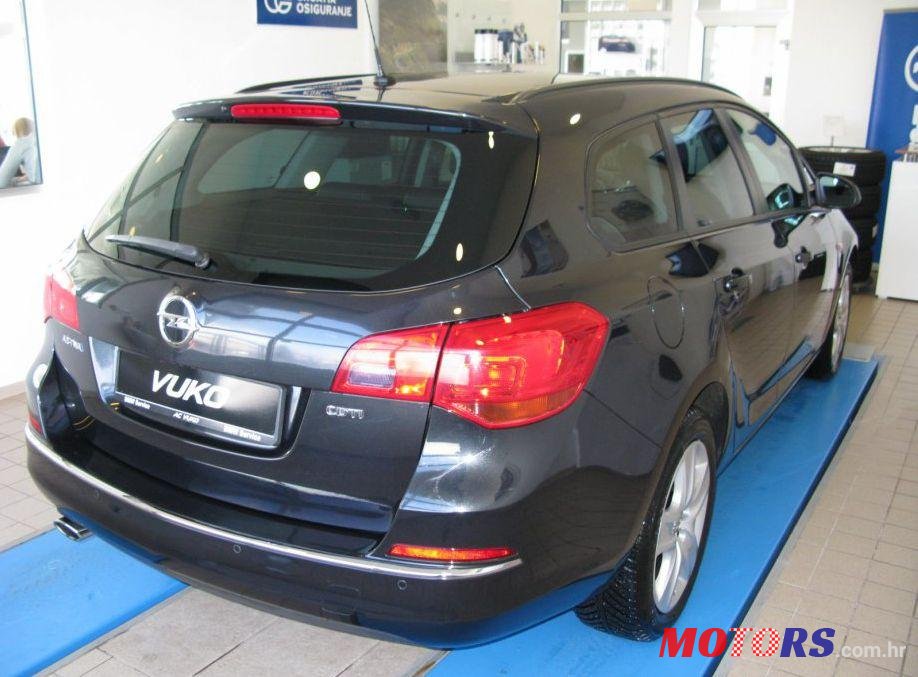 2014' Opel Astra Karavan photo #1