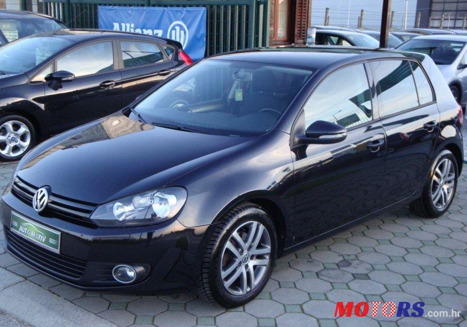2011' Volkswagen Golf VI 1,6 Tdi photo #1