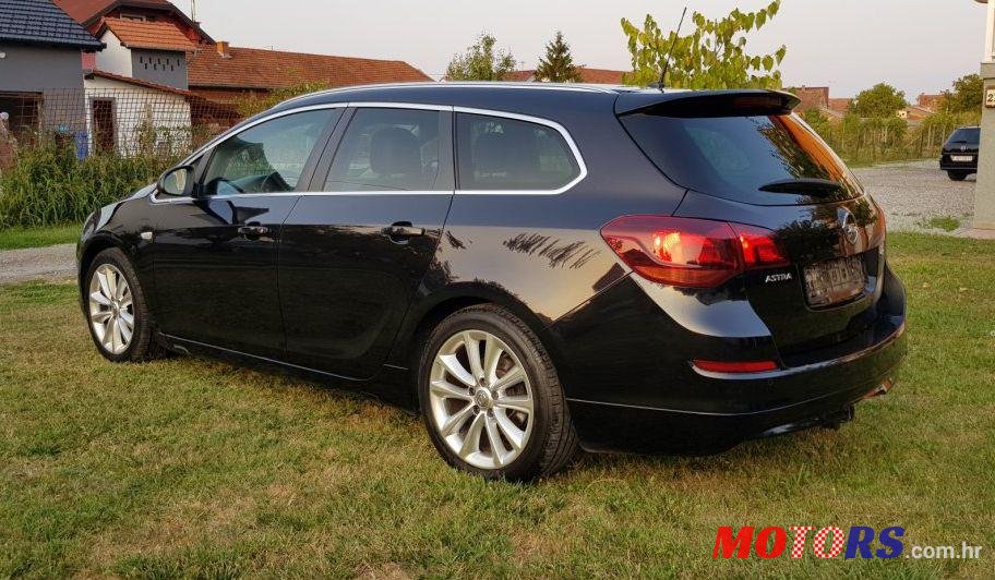 2011' Opel Astra Karavan Sports photo #1