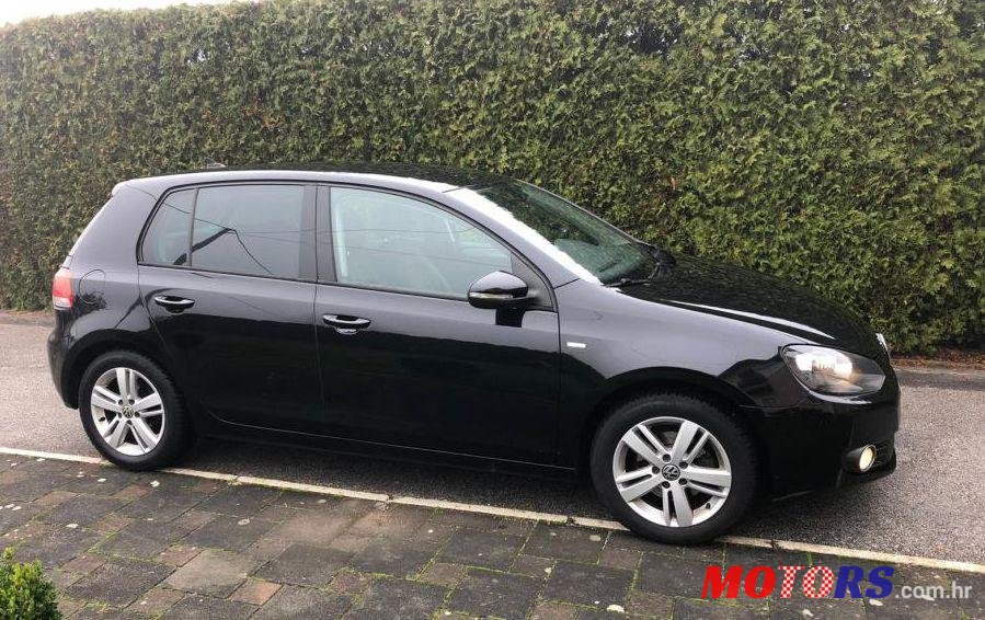 2012' Volkswagen Golf VI 1,6 Tdi photo #1